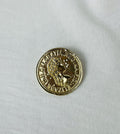 Broche f moneda