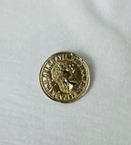 Broche f moneda
